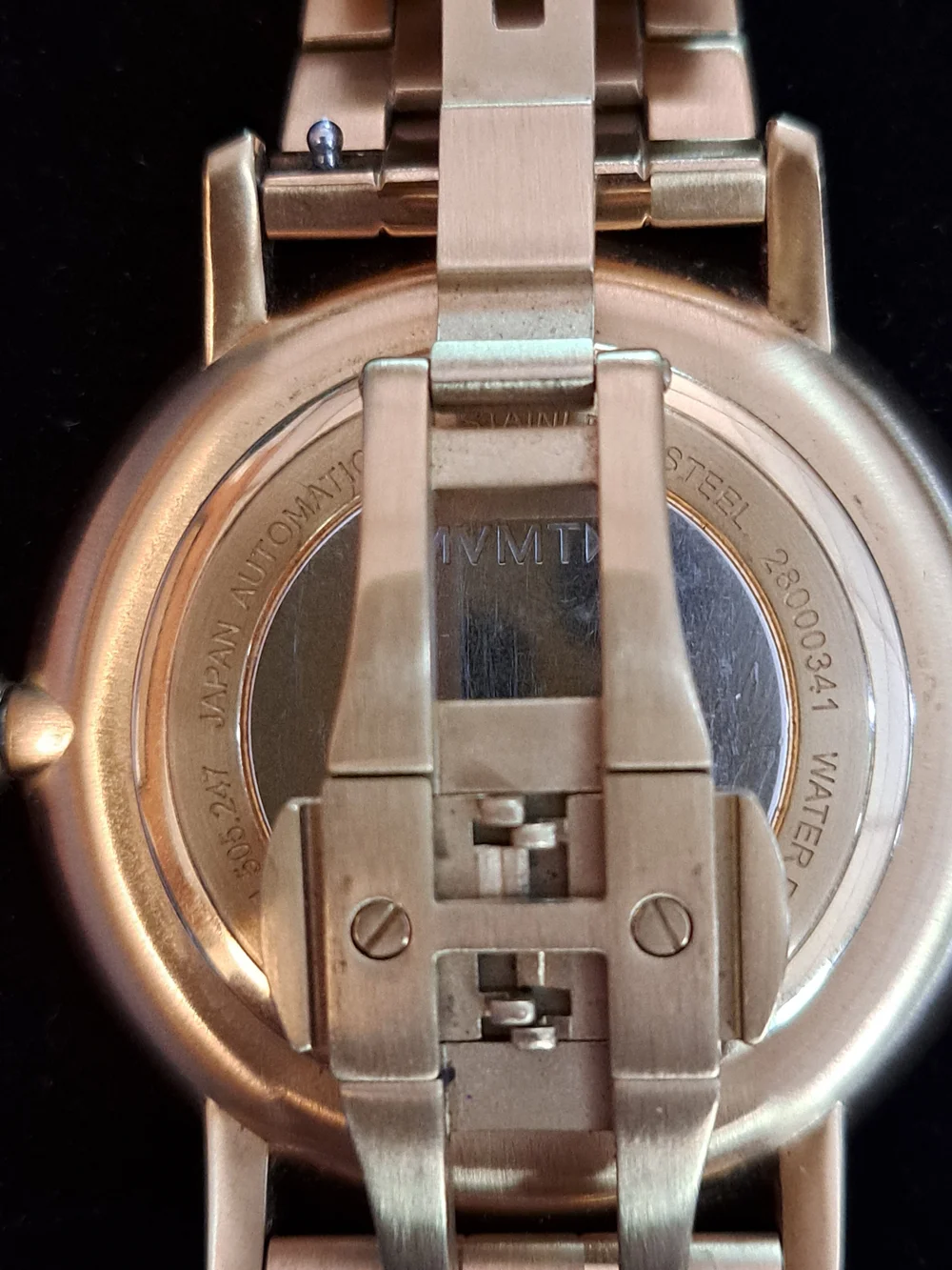MVMT Gold Bracelet Watch with Green Dial and Open Heart